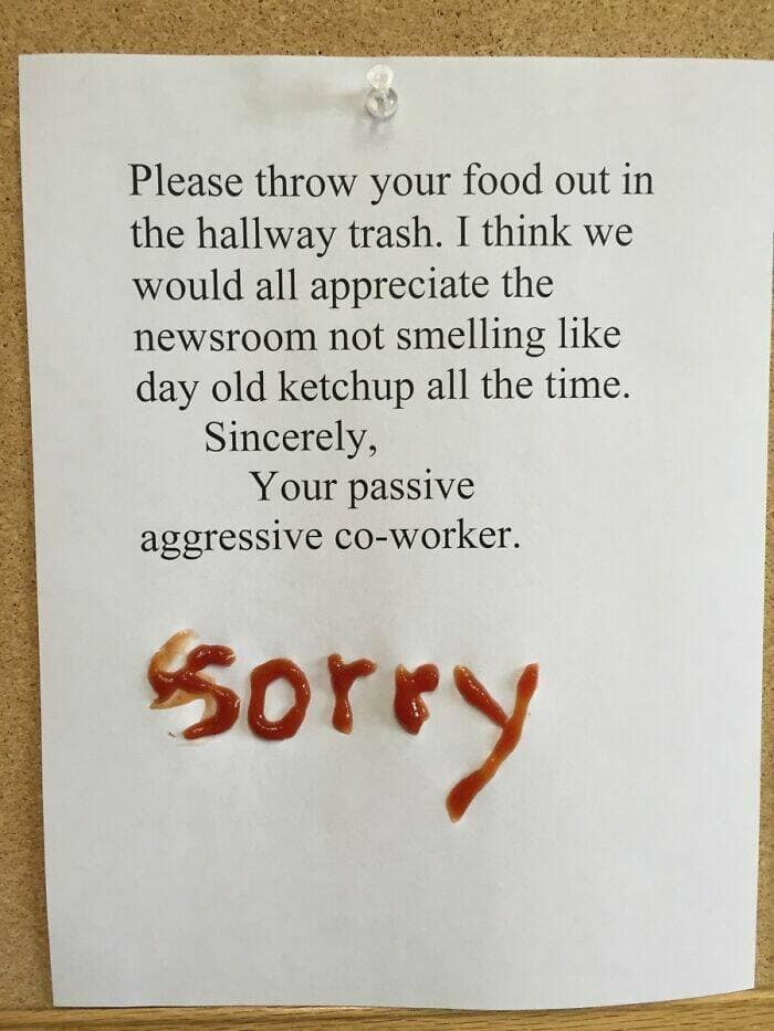 An office note asking people to throw food out, with a response written in ketchup saying "Sorry."