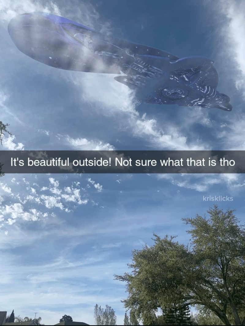 A funny sci-fi meme showing a giant Halo Covenant ship appearing in the sky on a beautiful day.