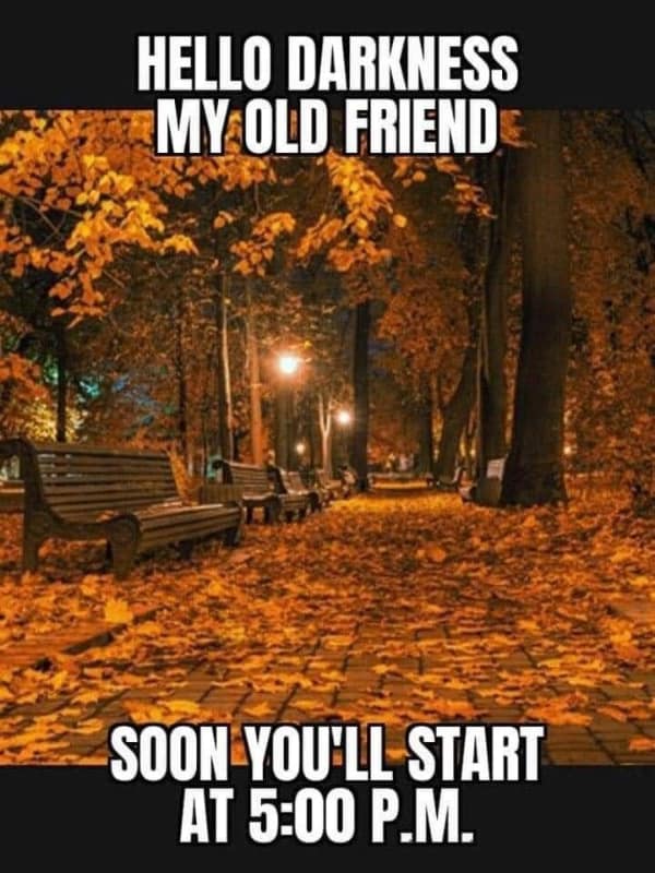 A funny autumn meme with the "Hello Darkness My Old Friend" lyrics, joking about early sunsets.