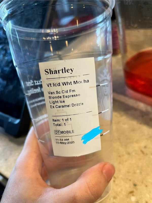 A funny unfortunate name on a Starbucks cup, where the name Hartley has been misspelled as "Shartley."