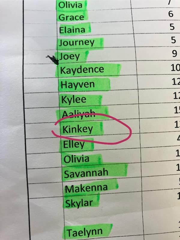 An unfortunate name, "Kinkey," circled on a printed-out class list with highlighted names