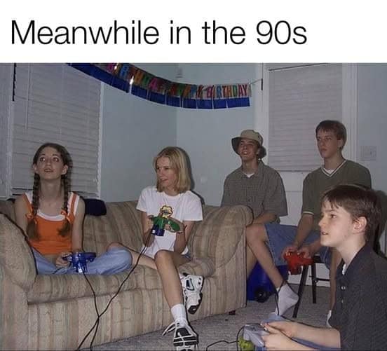 90s nostalgia picture of friends playing video games on a couch together