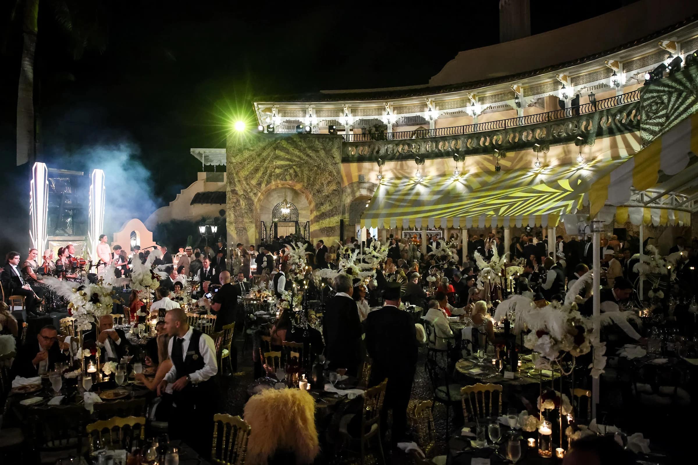 A wide-angle photo of the lavish, crowded outdoor setup at the Mar-a-Lago Great Gatsby party.