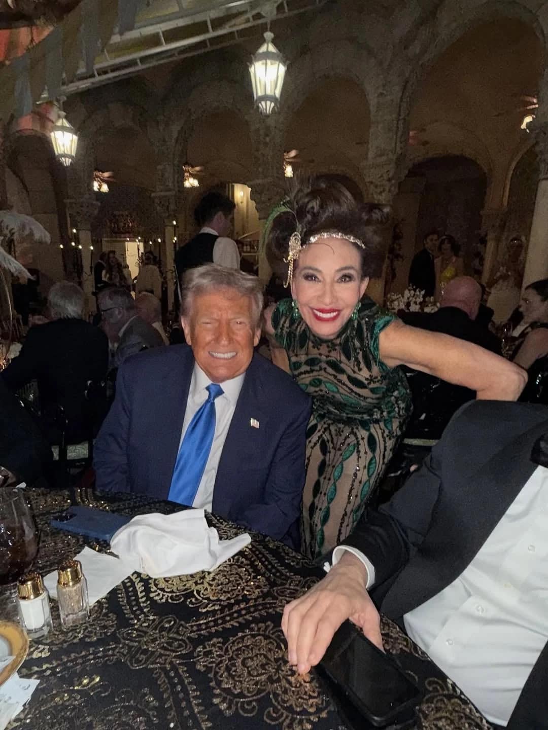 A photo of Donald Trump smiling at the Mar-a-Lago Great Gatsby-themed Halloween party.