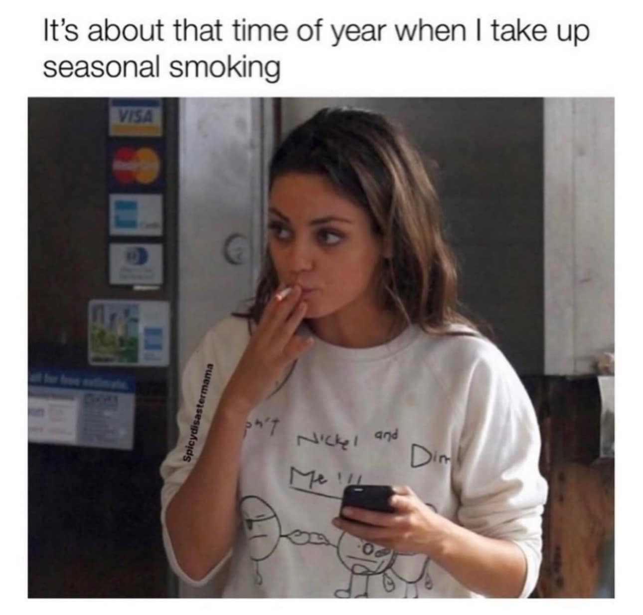 Mila Kunis lighting a cigarette in a classic meme about seasonal habits.