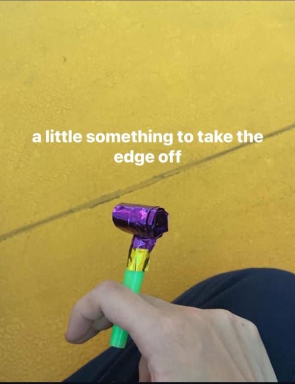 A classic meme of a person holding a party blower, captioned "a little something to take the edge off."