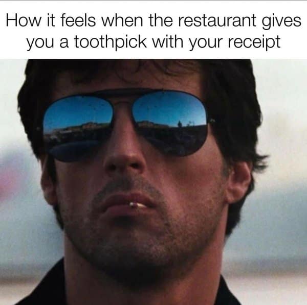 A classic meme of Sylvester Stallone with a toothpick, joking about the "cool" feeling a restaurant toothpick gives you.