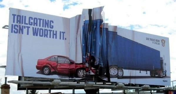 Crumpled billboard showing a car crash for a clever ad about tailgating.