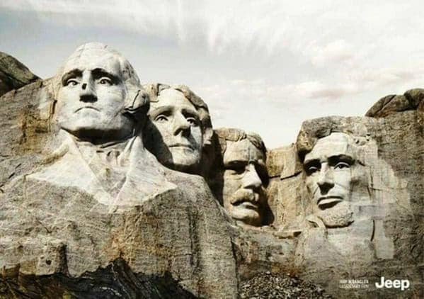 Mount Rushmore presidents looking sideways at an off-road vehicle in a Jeep clever ad.