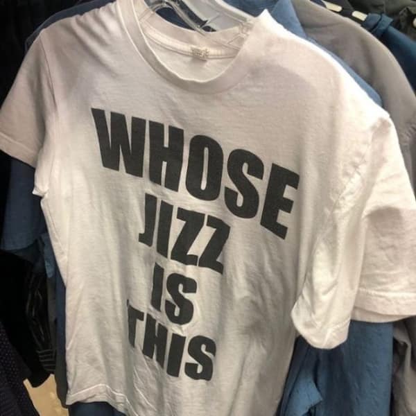 Shocking white graphic t-shirt with baffling and inappropriate bold text.
