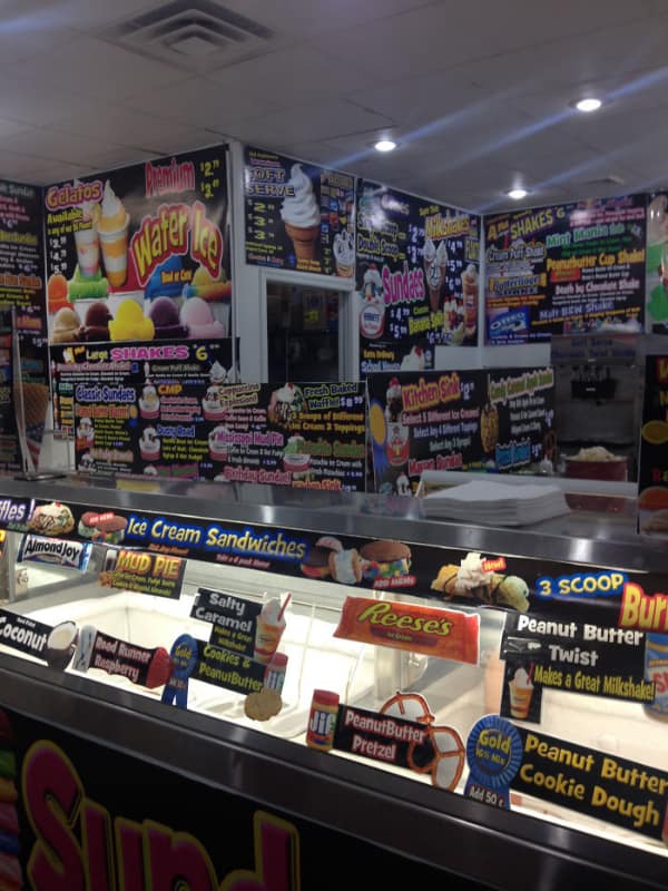 A cluttered menu design fail with overwhelming text and colors.