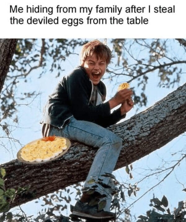 Leonardo DiCaprio hiding in a tree eating a plate of stolen deviled eggs.