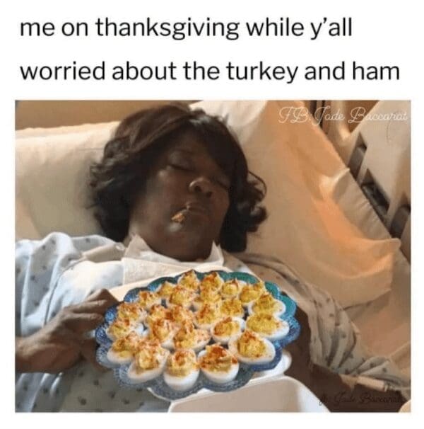Woman sleeping in a hospital bed holding a large platter of deviled eggs.