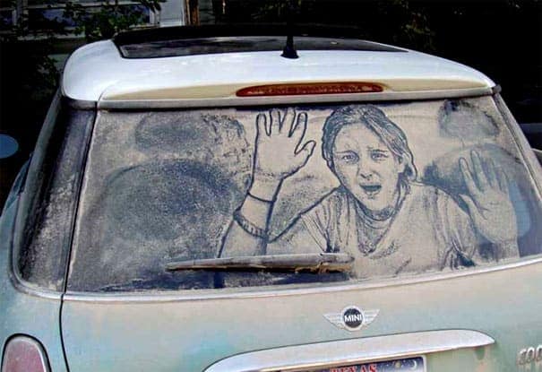 Realistic dirty car drawing of a woman pressing her face and hands against the glass.
