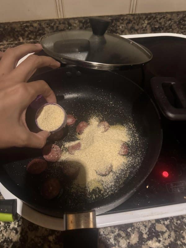 A funny fail in the kitchen where someone accidentally dumped an entire jar of garlic powder on sausages.