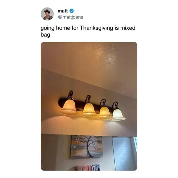 Bathroom vanity light fixture with mismatched warm and cool light bulbs.