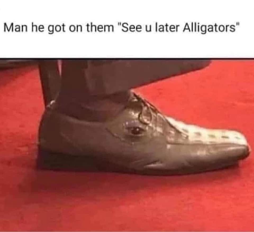 Dress shoe made of reptile skin featuring a literal alligator eye on the side.