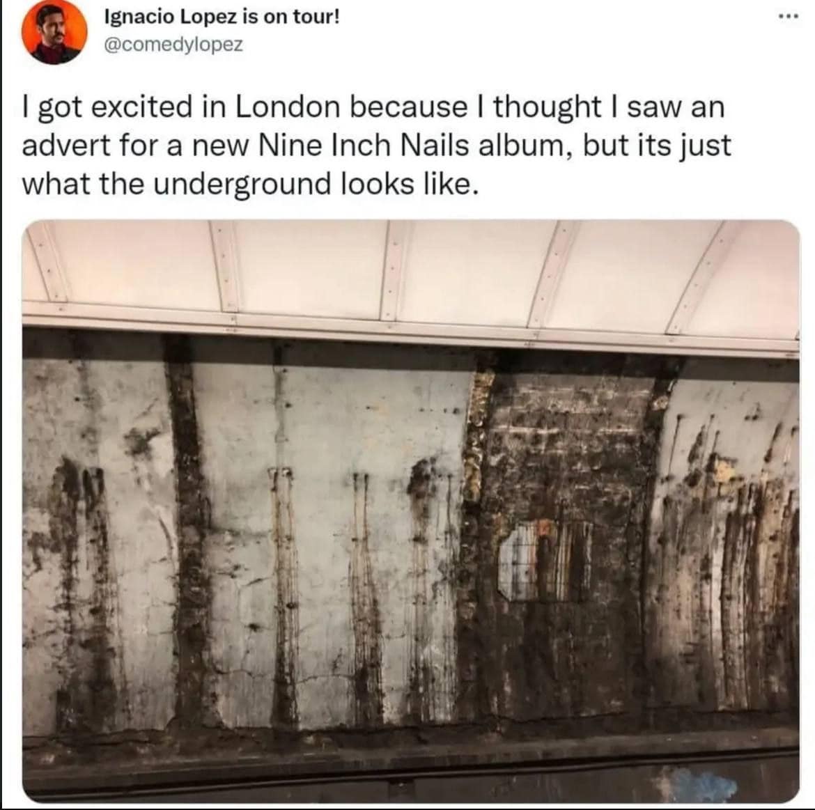 Grimy London Underground tunnel wall that looks like industrial Nine Inch Nails art.