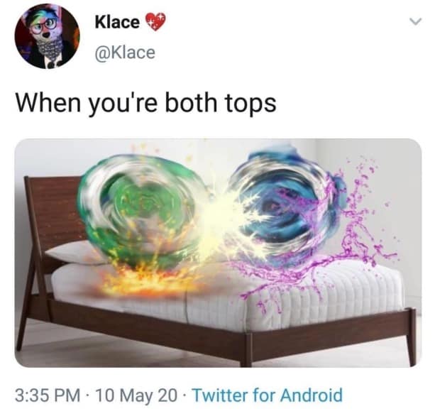 Two Beyblades spinning and colliding with sparks captioned when you are both tops.