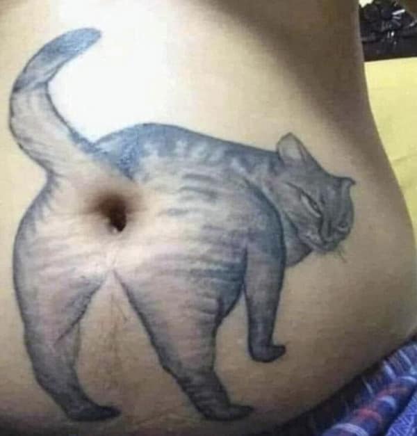 Cat tattoo on a stomach using the belly button as the cat's anus.