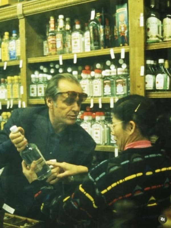 A funny work meme using the Grinch with a large bag, joking about returning from PTO to a mountain of work.