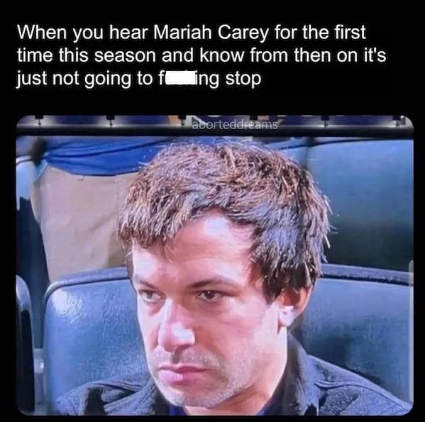 A Mariah Carey meme of a distressed man reacting to hearing her song for the first time this season.