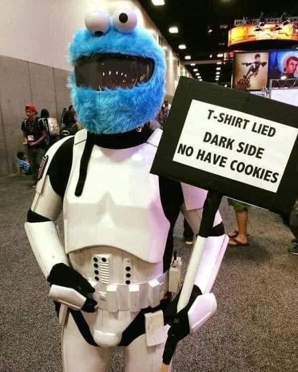 Cookie Monster Stormtrooper cosplay holding sign about Dark Side cookies