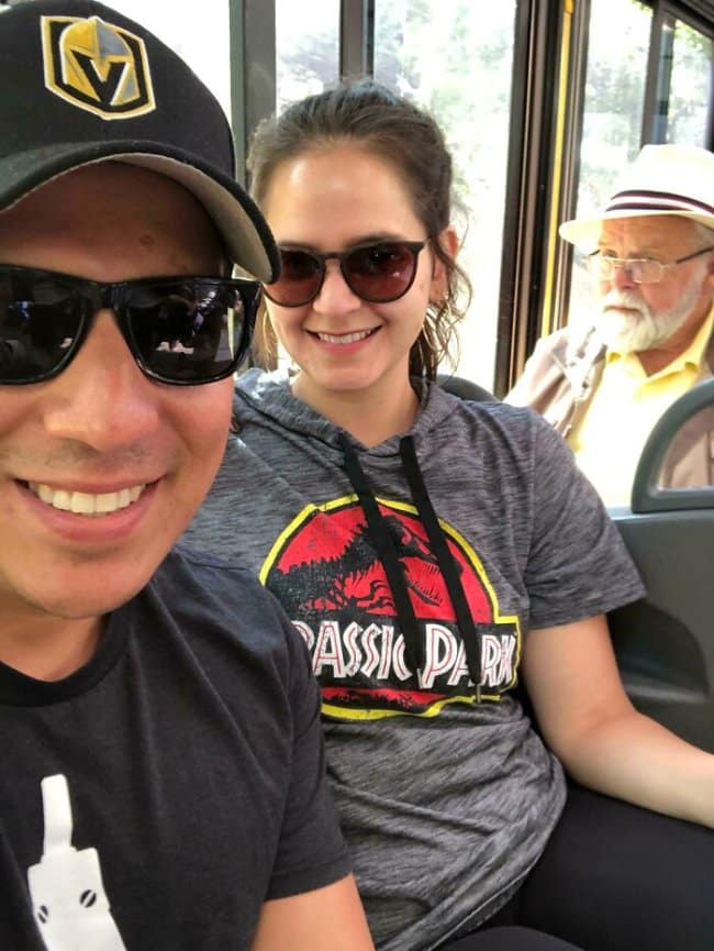 Couple's bus selfie photobombed by an old man who looks exactly like the Jurassic Park character.