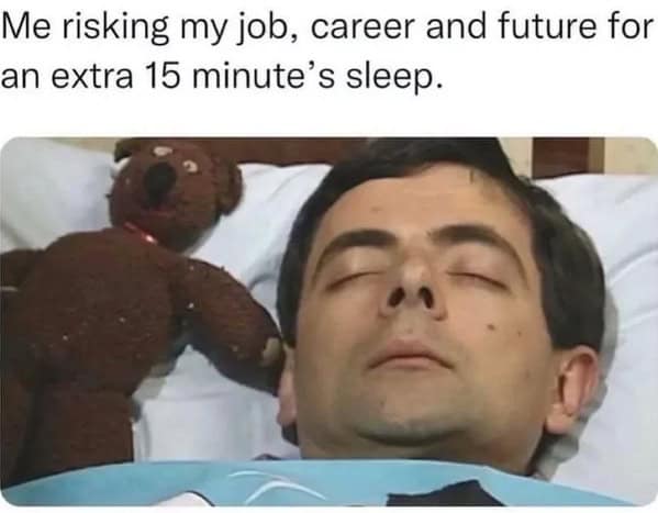 Mr. Bean sleeping soundly in bed, a funny sleep meme about risking it all for 15 extra minutes.