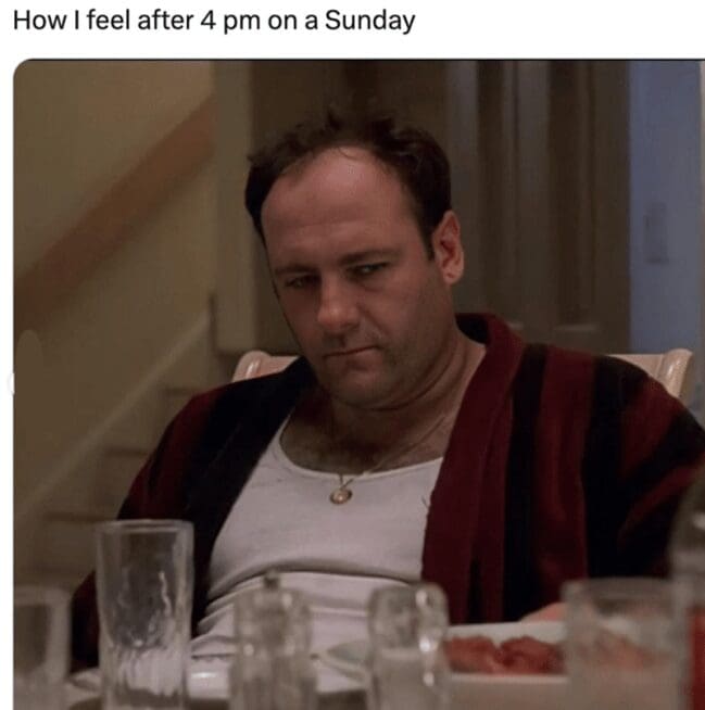 Tony Soprano looking depressed at the dinner table in a relatable Sunday meme.