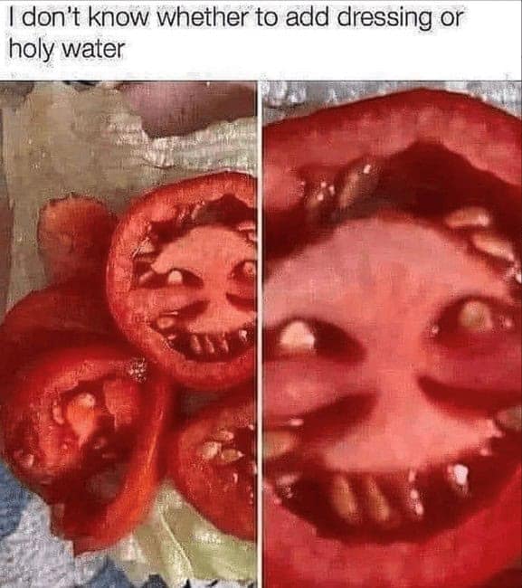 Cursed tomato meme of a tomato slice with a terrifying, demonic-looking face inside it.