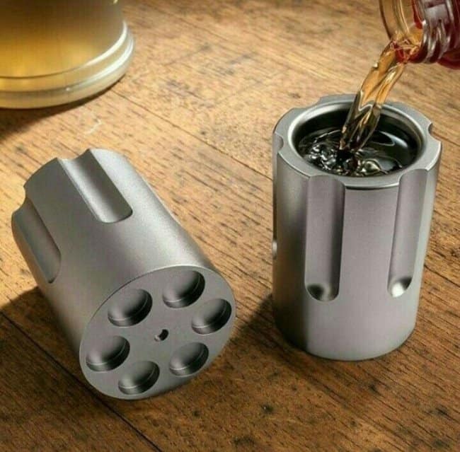 A set of cool metal shot glasses designed to look like the chamber of a revolver.