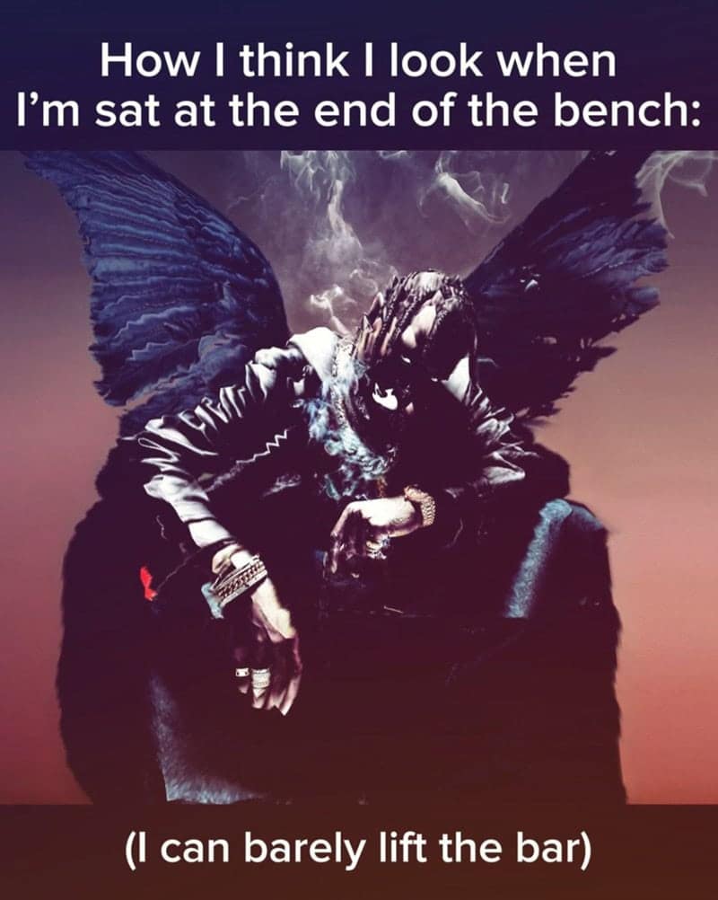 Travis Scott looking mysterious on a bench press while barely being able to lift the bar.