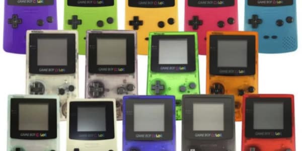 This 90s toy image displays a collection of Game Boy Color consoles in various colors