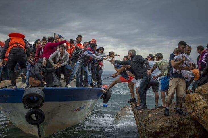 An accidental renaissance painting photo of people being helped from a boat onto rocks with dramatic stormy lighting