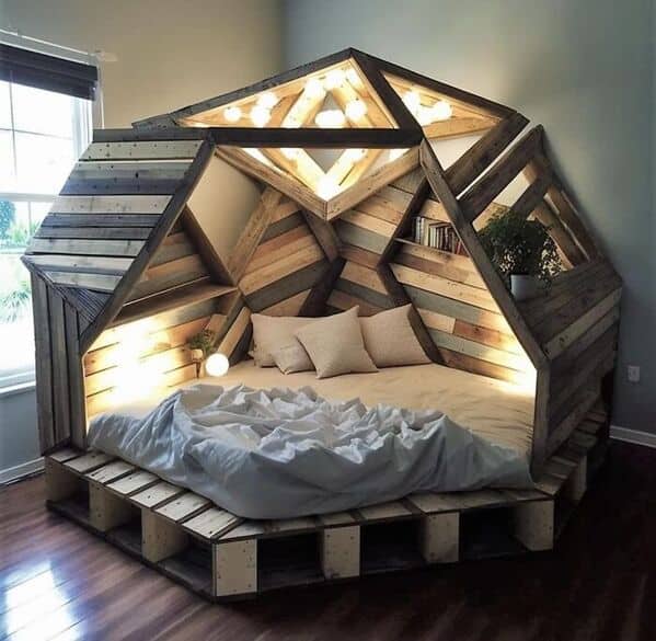In this amazing woodworking image, a geometric wooden bed frame creates a cozy pod