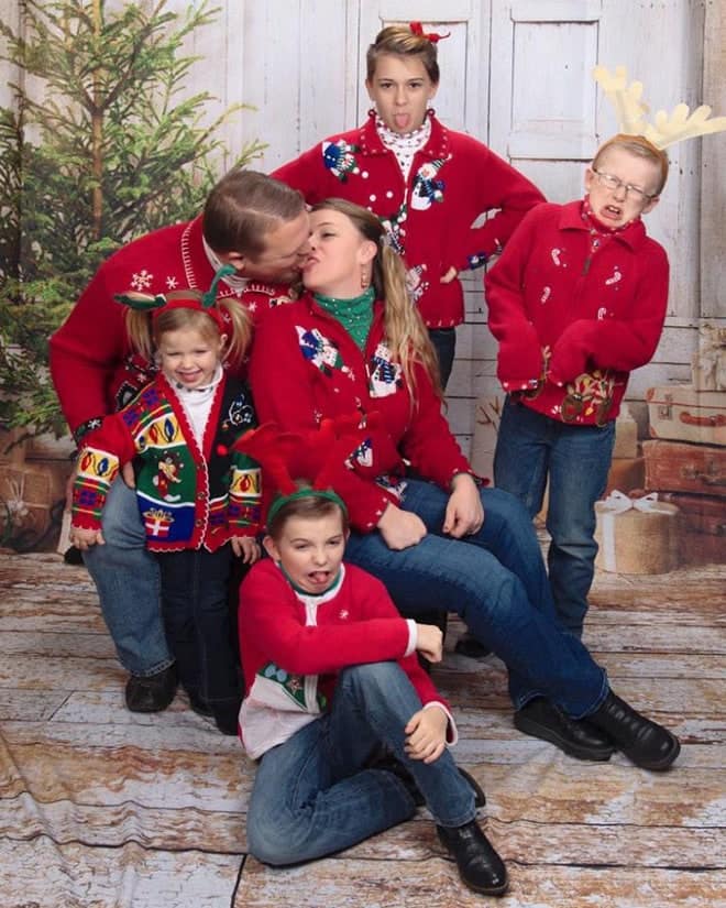 In this awkward family christmas photo, family members are licking each other's faces.