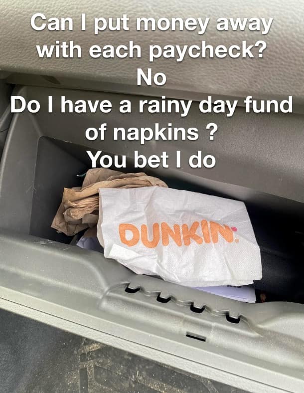 A classic meme photo of a car glovebox stuffed with Dunkin napkins as a rainy day fund.