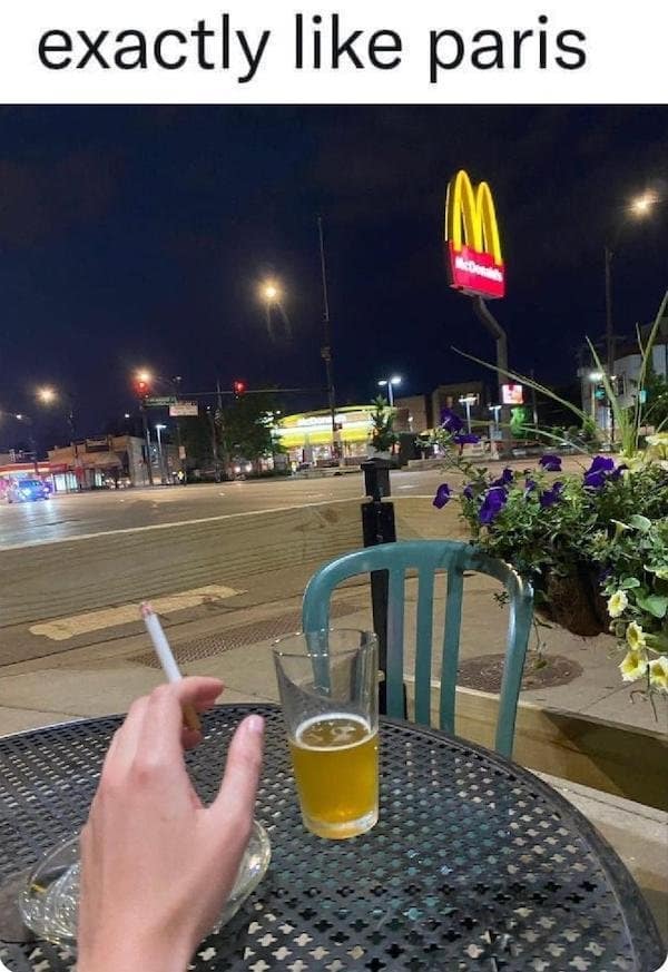 A classic meme photo of a McDonald's sign at night compared to the aesthetic of Paris.