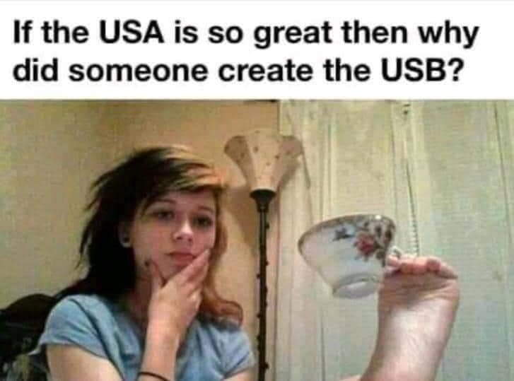 A classic meme questioning why the USA created the USB next to a girl holding a tea cup with her feet.