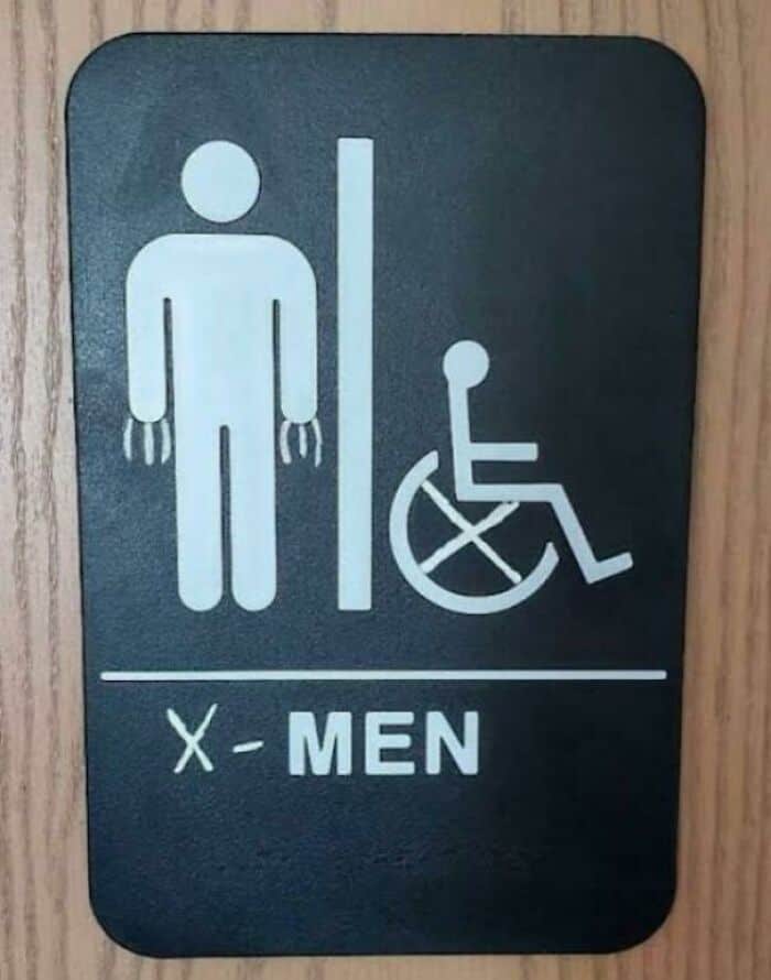 A creative vandalism modification of a restroom sign turning the figures into X-Men characters.