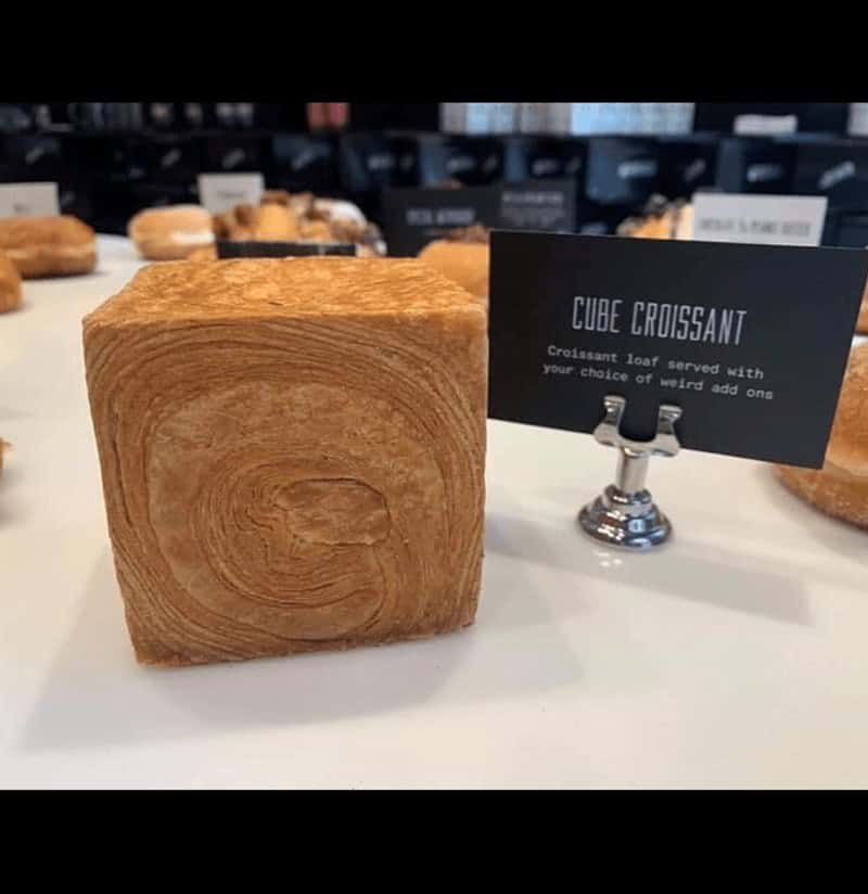 A croissant meme showing a perfectly square cube pastry.