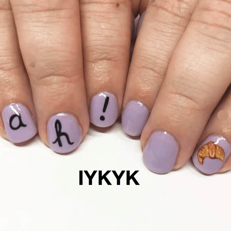 A croissant meme showing purple nails referencing the "dropped my croissant" vine.