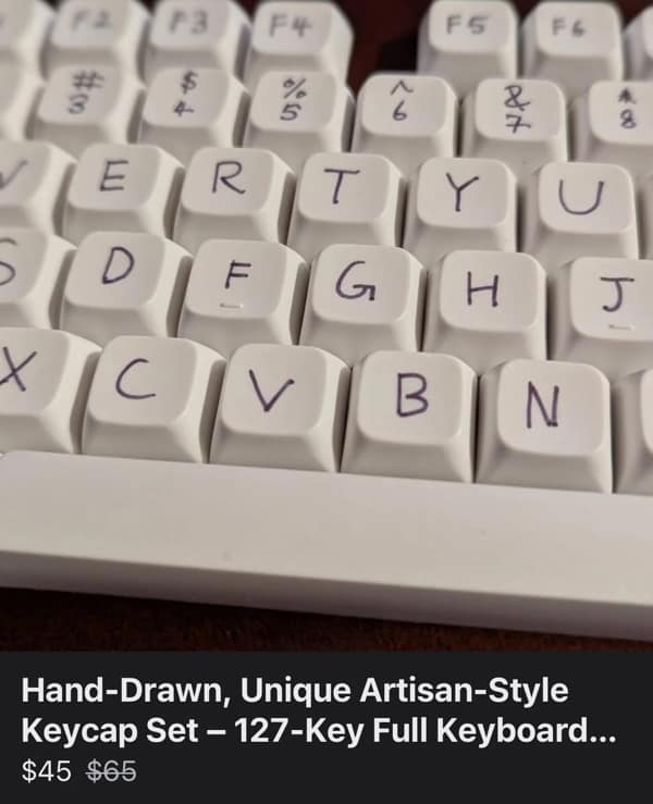 Mechanical keyboard keys with letters drawn on in marker used as a cursed image