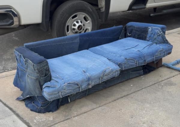 Sofa upholstered entirely with blue jeans used as a cursed image