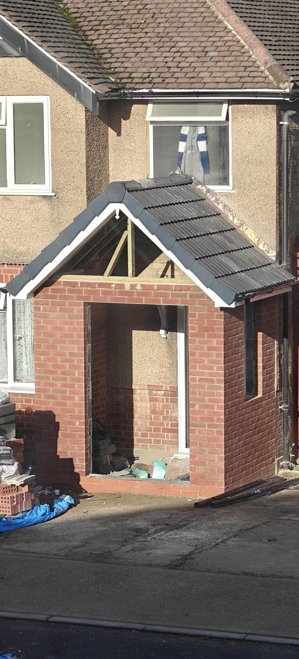 A di-why brick porch extension built completely blocking the front window.