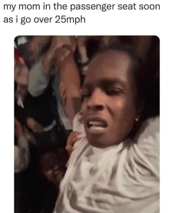 Rapper ASAP Rocky looking terrified while being held up in a crowd.
