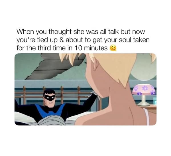 Cartoon superhero tied to bed looking surprised at blonde woman in room.