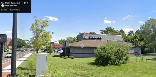 AFC Urgent Care medical clinic operating inside a grey former Pizza Hut building.