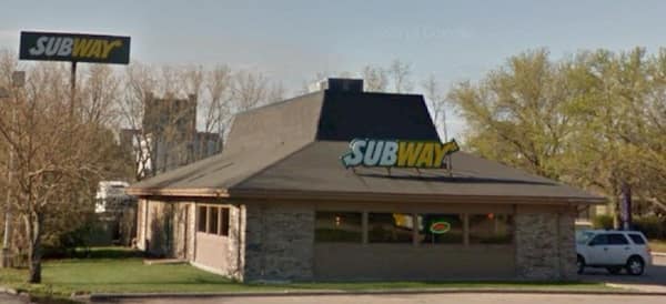 Subway sandwich shop sign on a stone building that is a former Pizza Hut.